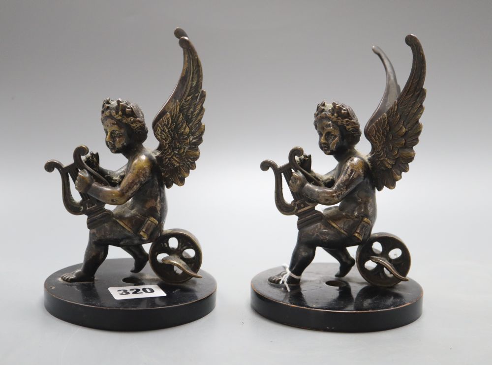 A pair of 19th century bronze cherub bookends, height 16cm